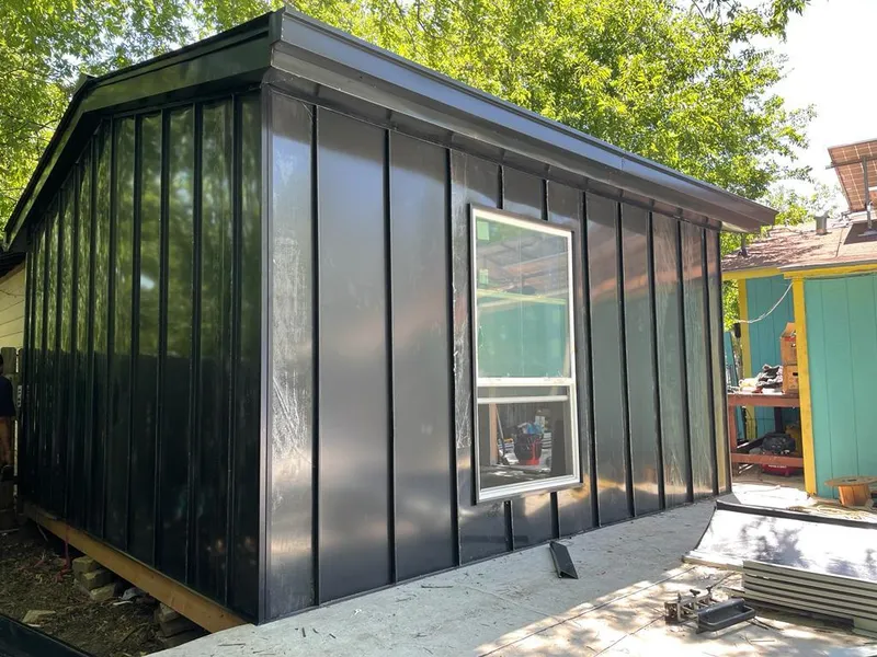 Black standing seam metal wall panels for Roof Inspection in Falls