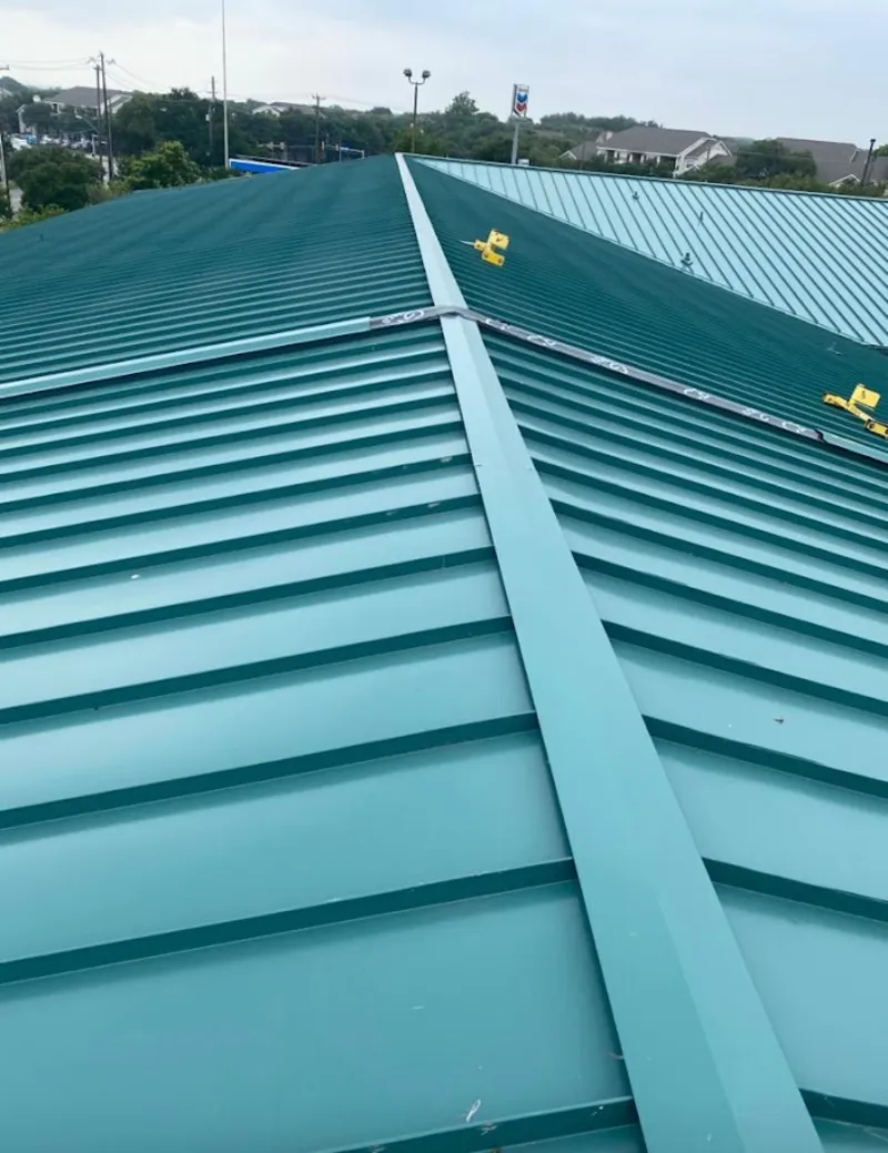 Green commercial metal roof ridge and valley for Metal Roof Repair in Falls